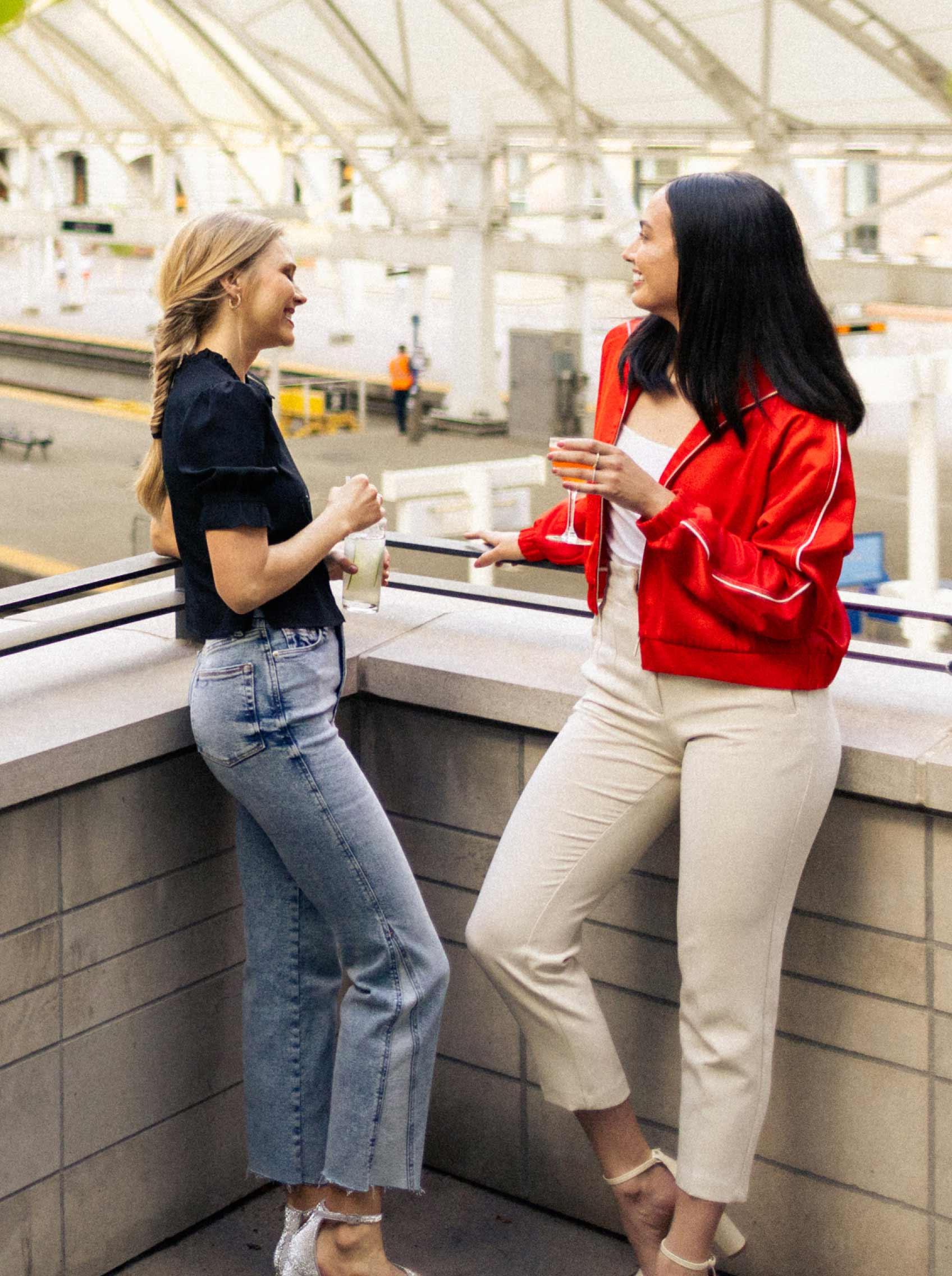 two women talking on limelight denver terrace