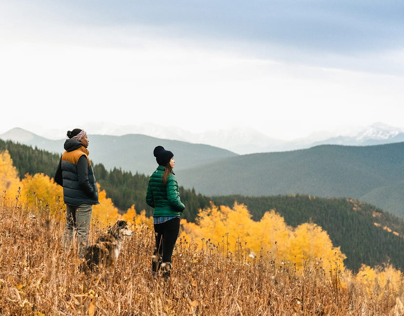 two people on hike in aspen mountains in the fall