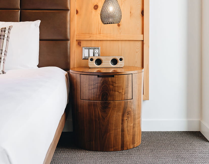 bed and night stand in guestroom