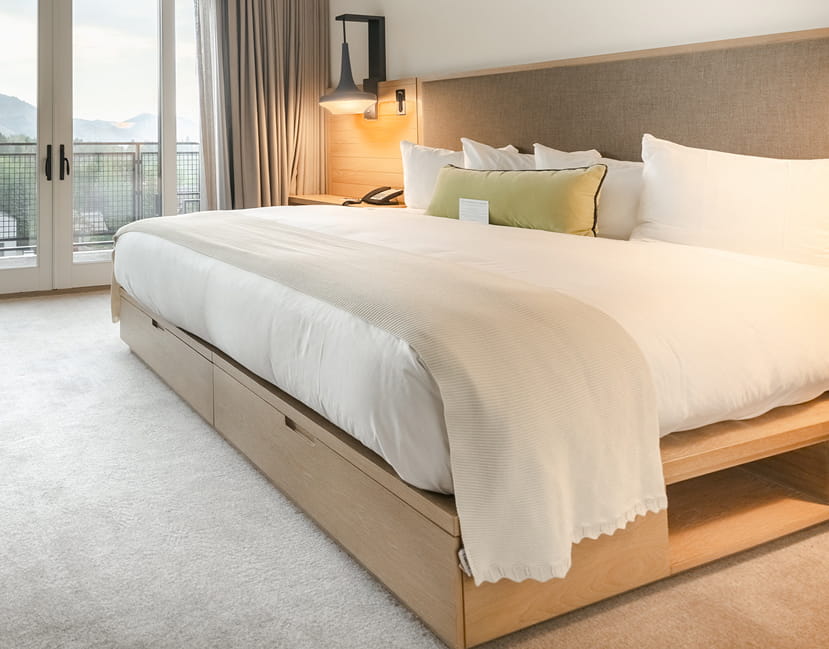 bed in guestroom at limelight ketchum