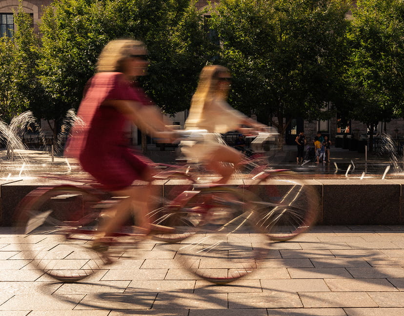 two women riding bikes in denver