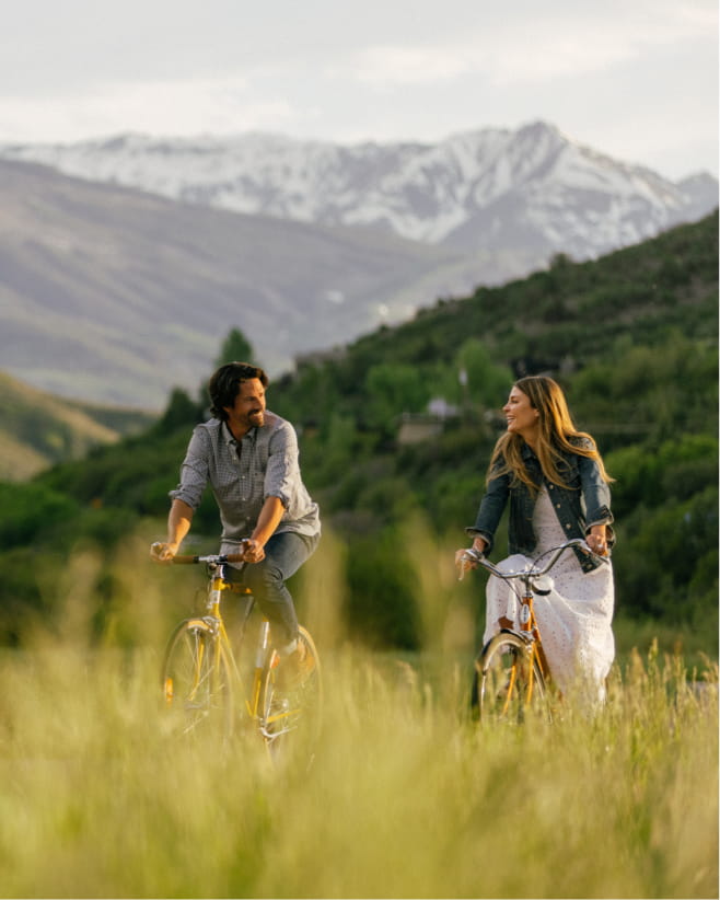 couple biking in mountains