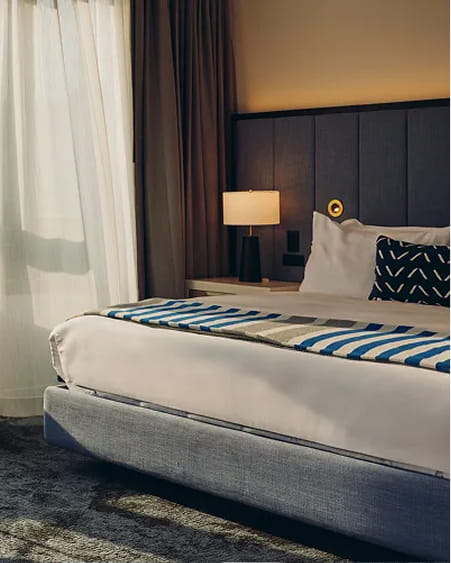 bed in guestroom at limelight boulder