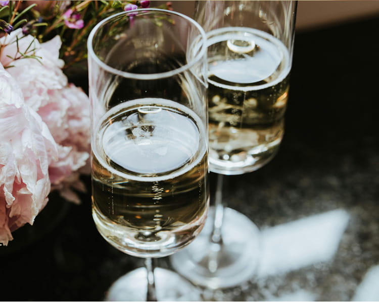 two glasses of champagne on table