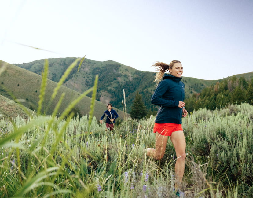 runners trail running through mountains