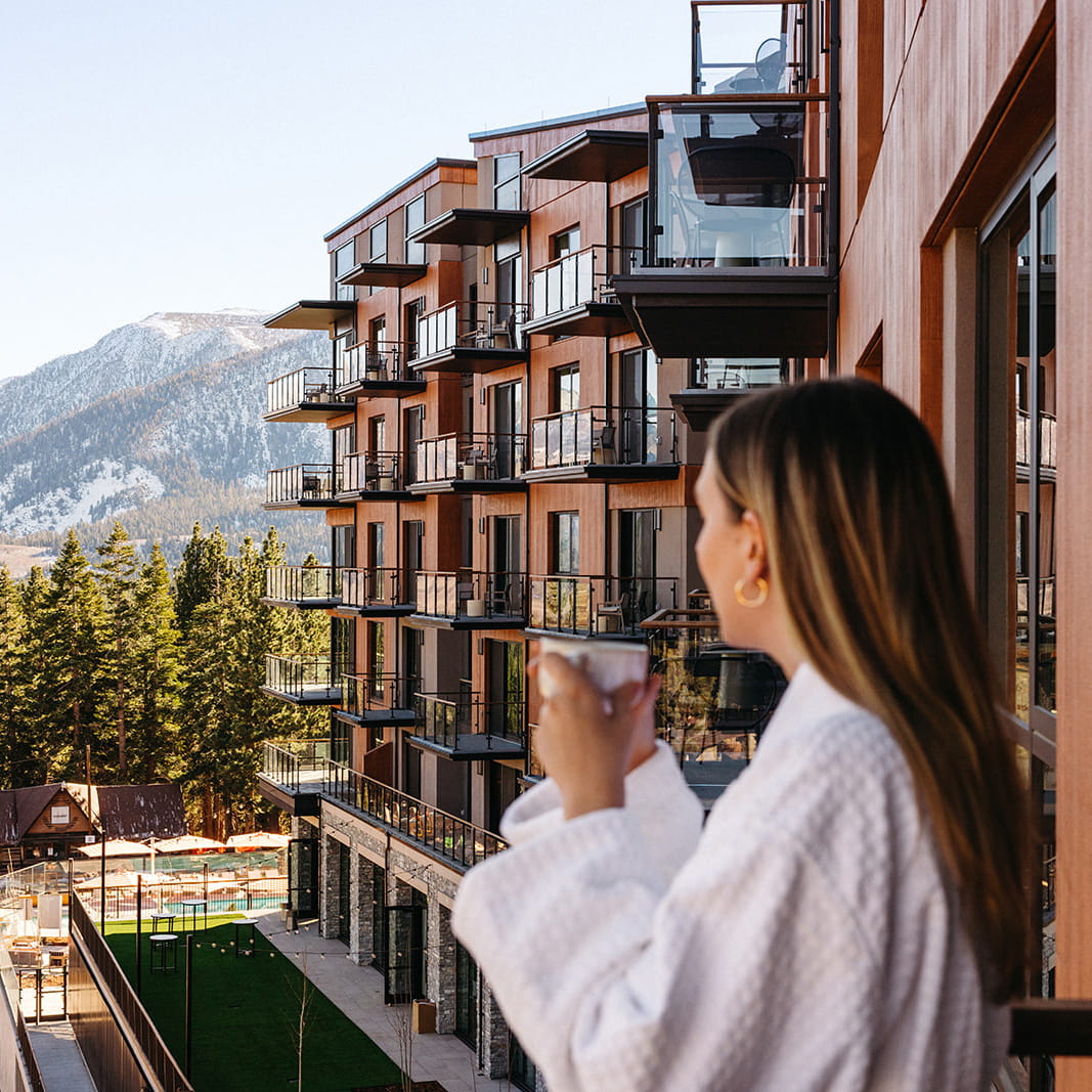 woman with coffee on limelight mammoth balcony