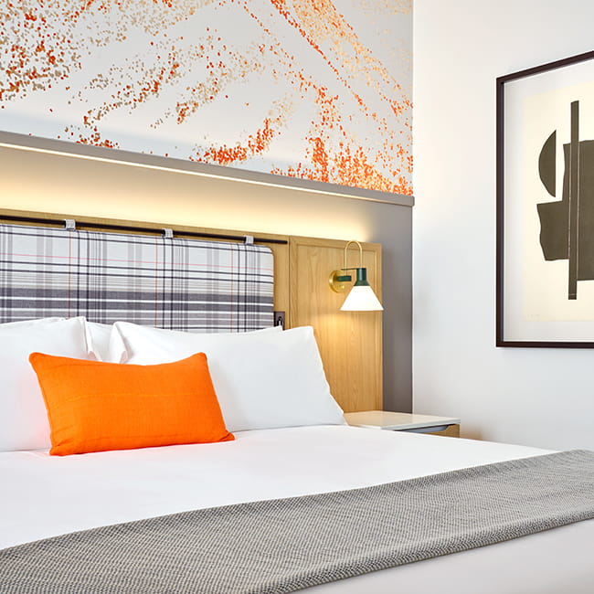 bed in guest room at limelight mammoth