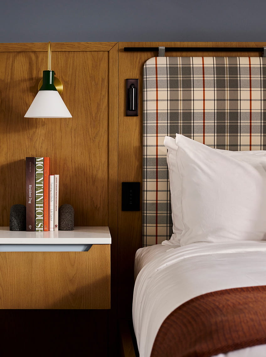 bed and night stand in guestroom