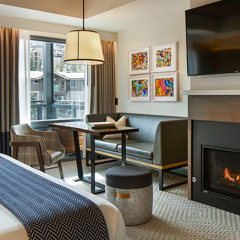 seating, window, and fireplace in guest room