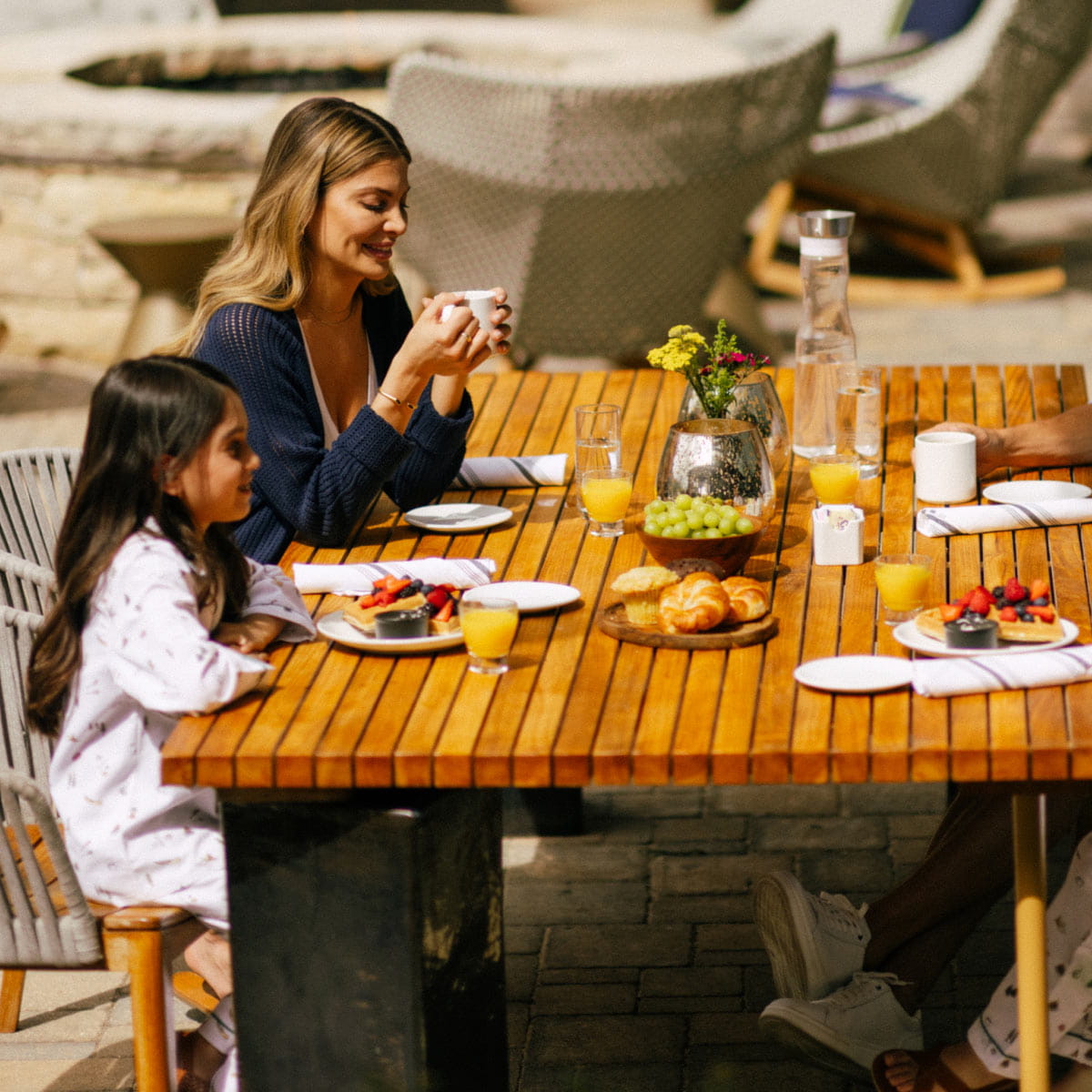 mother and daughter eating breakfast