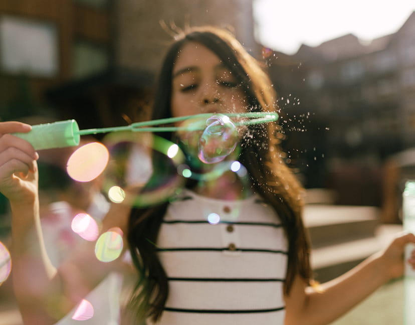 girl using bubbles