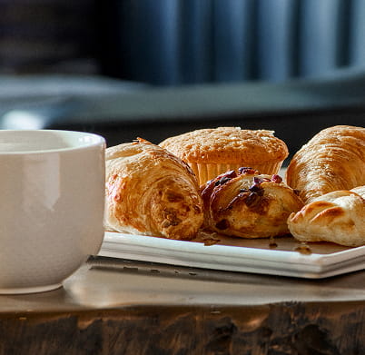 coffee cup and pastries on table