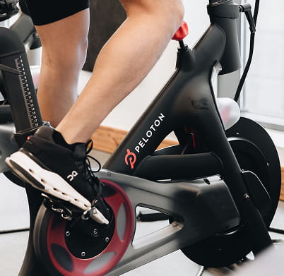 man on peloton bike