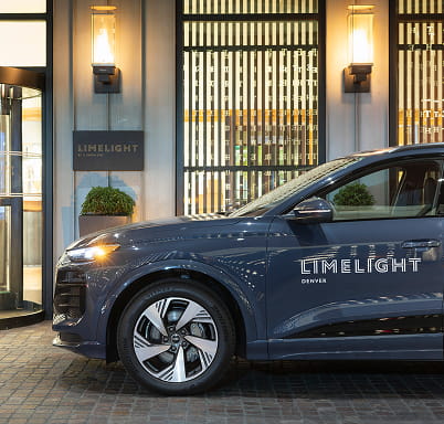 audi limelight SUV outside of hotel entrance
