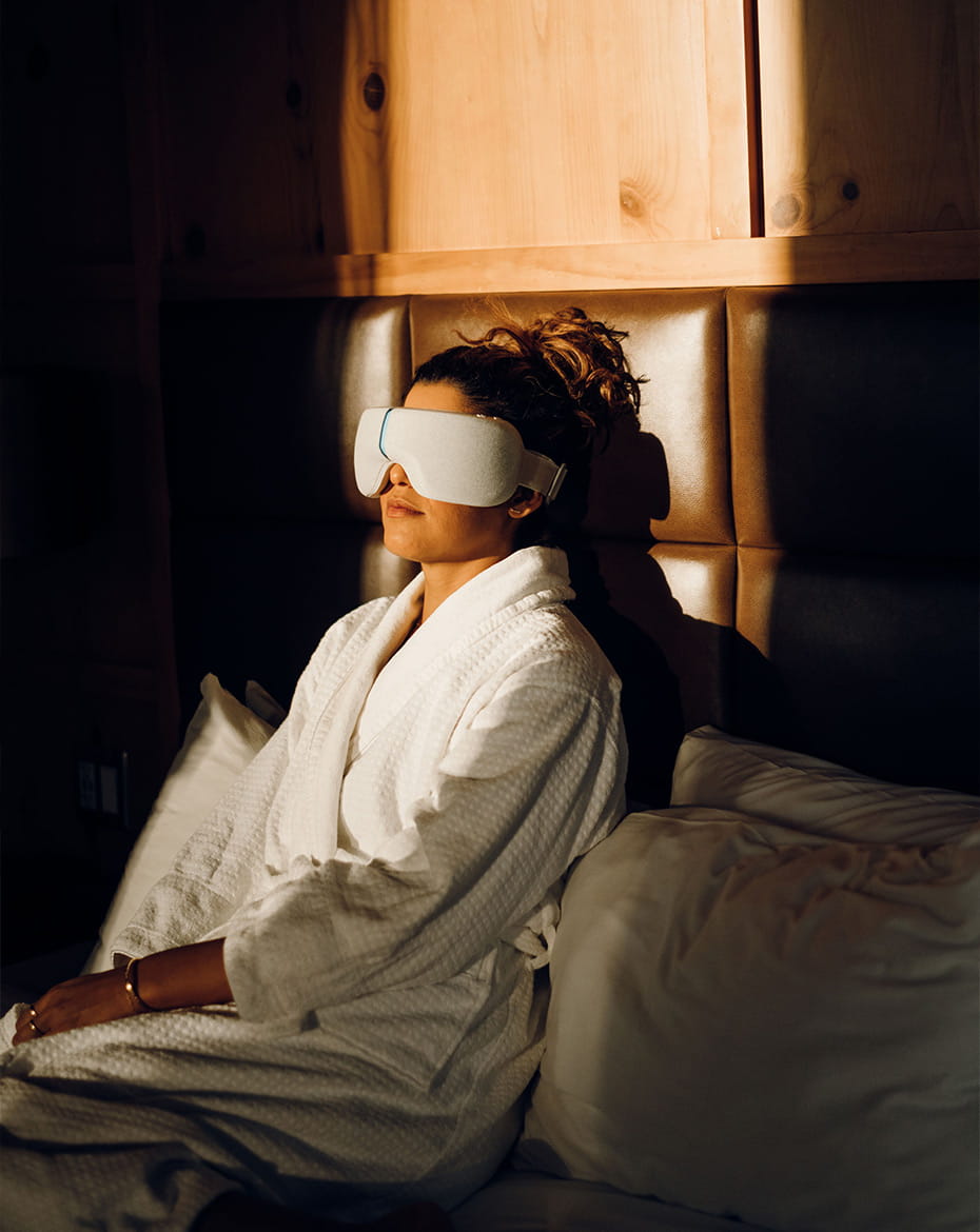 Girl using therabody googles in room