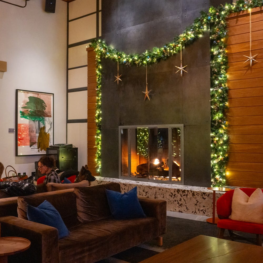 Fireplace with Christmas decor at the Limelight Aspen hotel