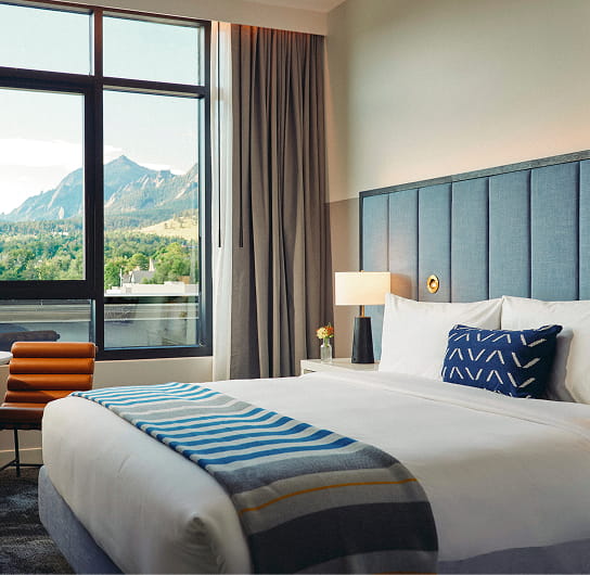 bed in guest room at limelight boulder