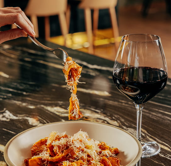 pasta and wine on table