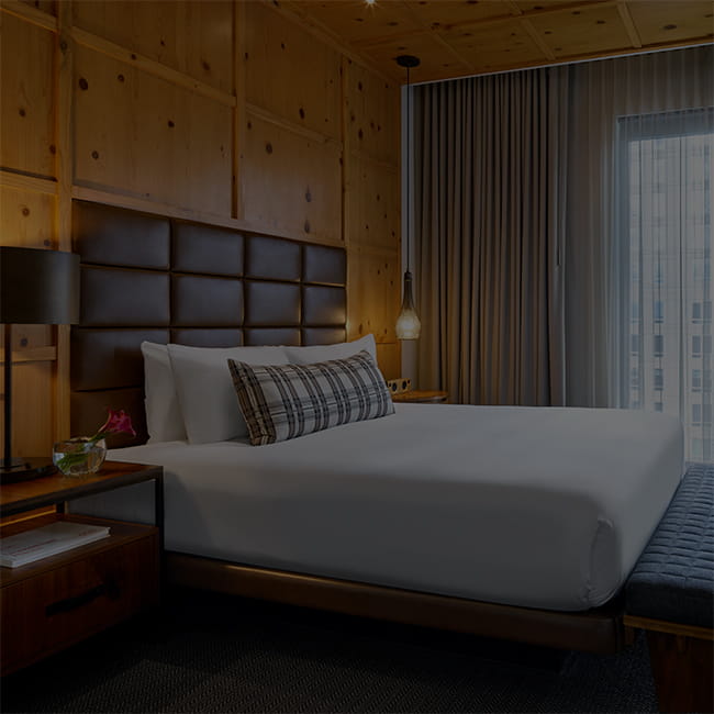 bed in guest room at limelight denver