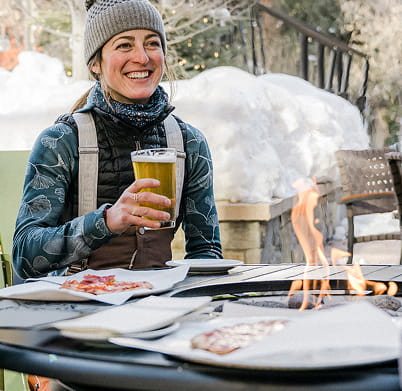 person enjoying beer on patio