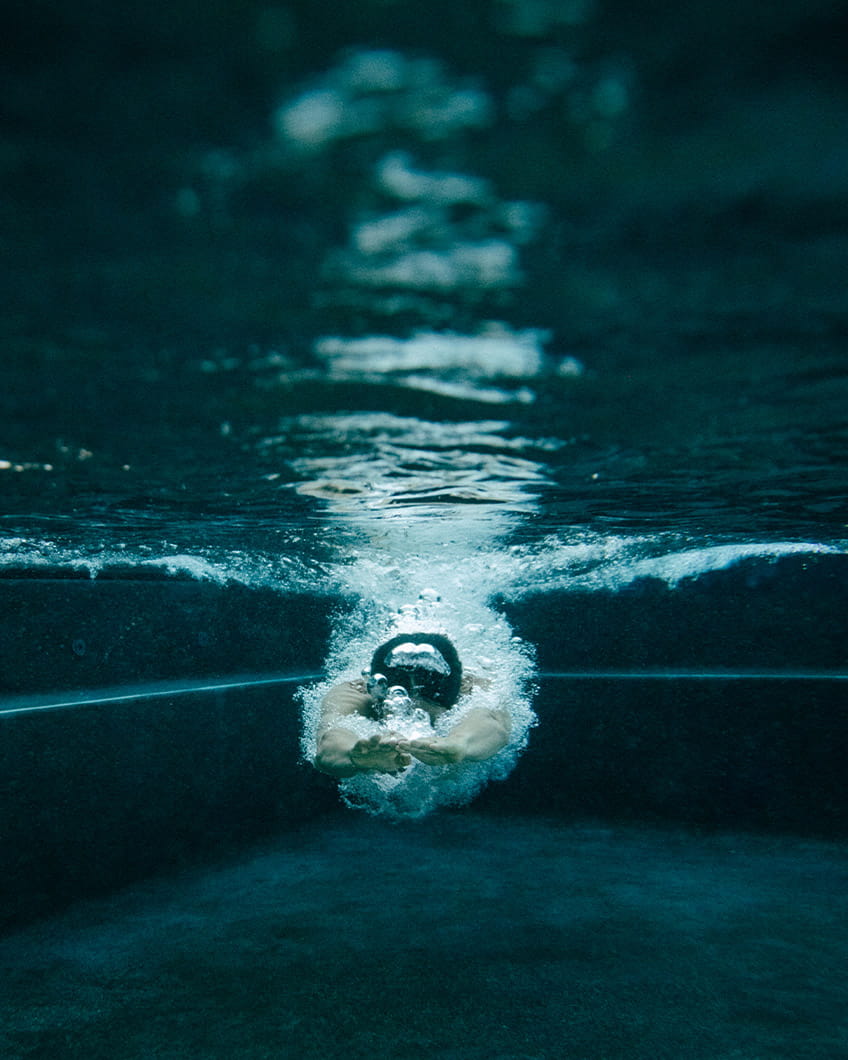 Man swimming in pool