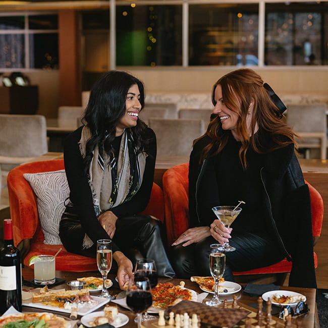 two women talking in limelight lounge