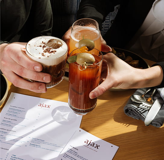 people toasting drinks