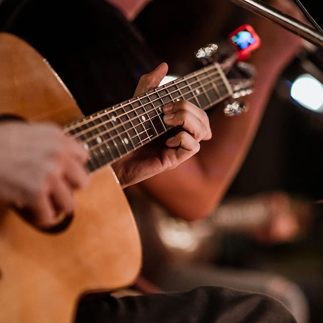 person playing guitar