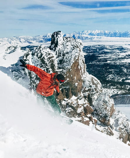 snowboarder skiing powder