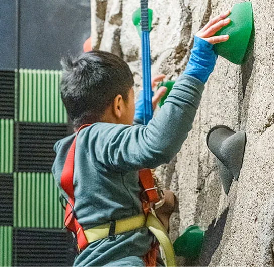 kid on rock wall