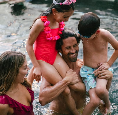 family in hot tub at limelight snowmass