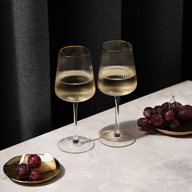 two wine glasses on table