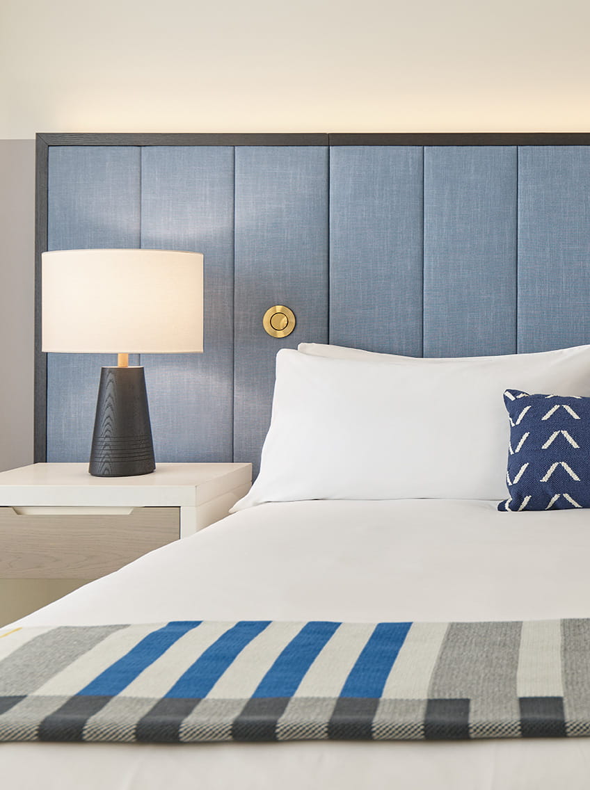 king bed and night stand in guest room