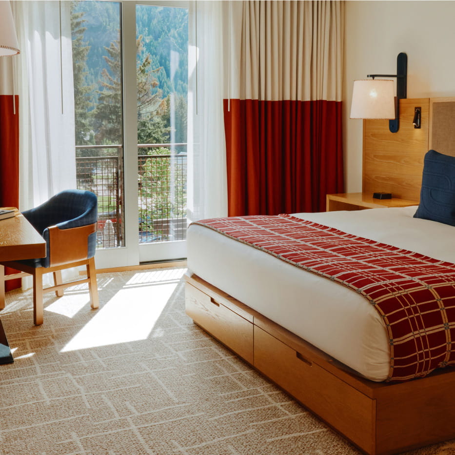 bed and table in deluxe room