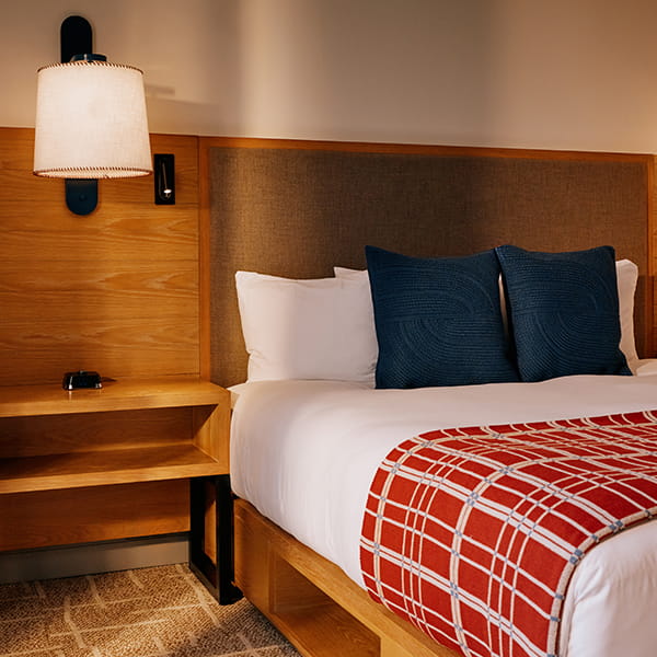 bed and night stand in guestroom