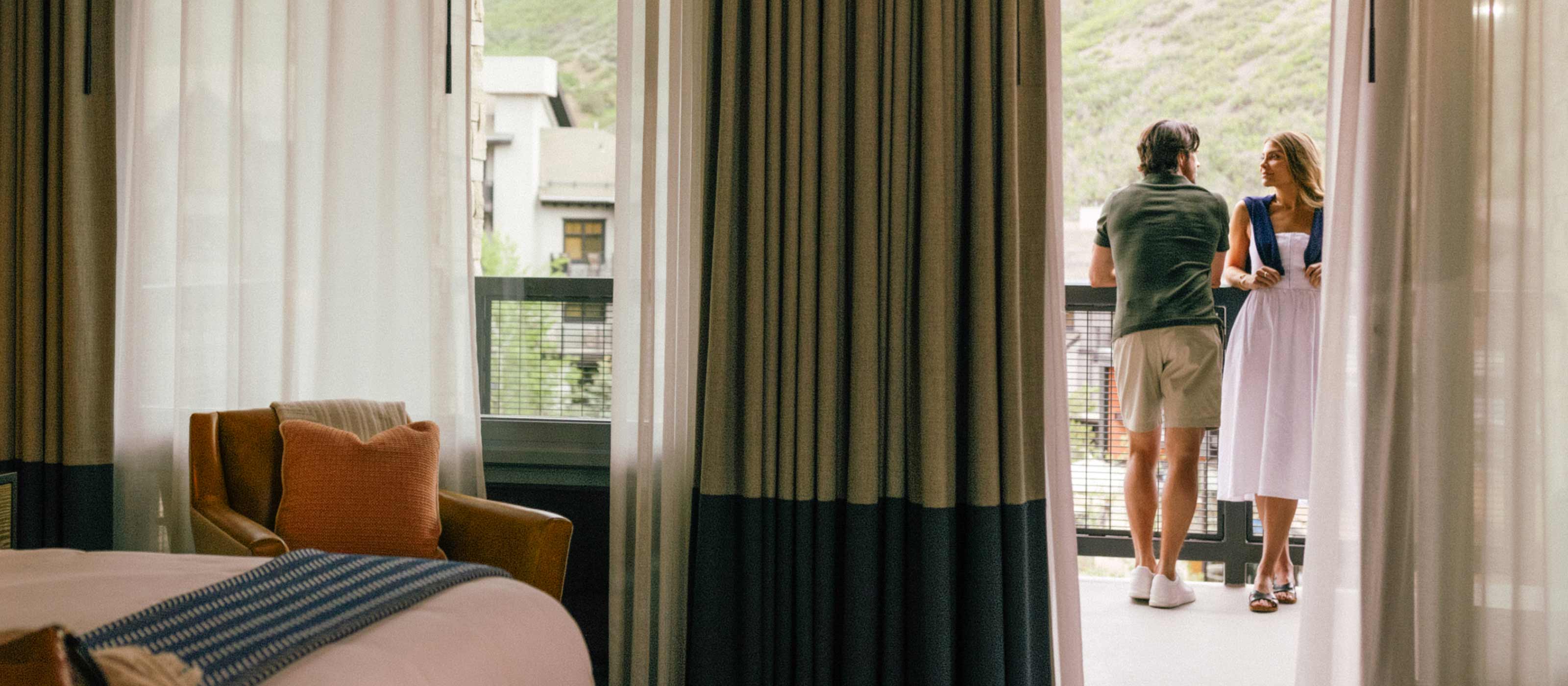 couple standing on balcony
