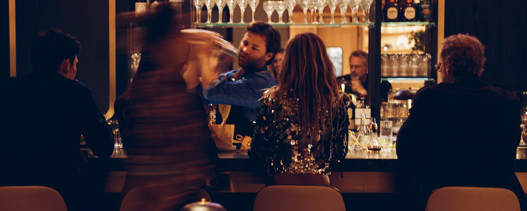 bar at ajax tavern with people at it