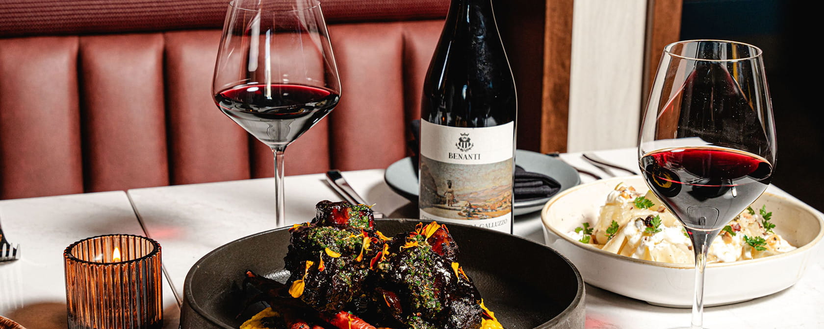 wine and food on table at ajax downtown