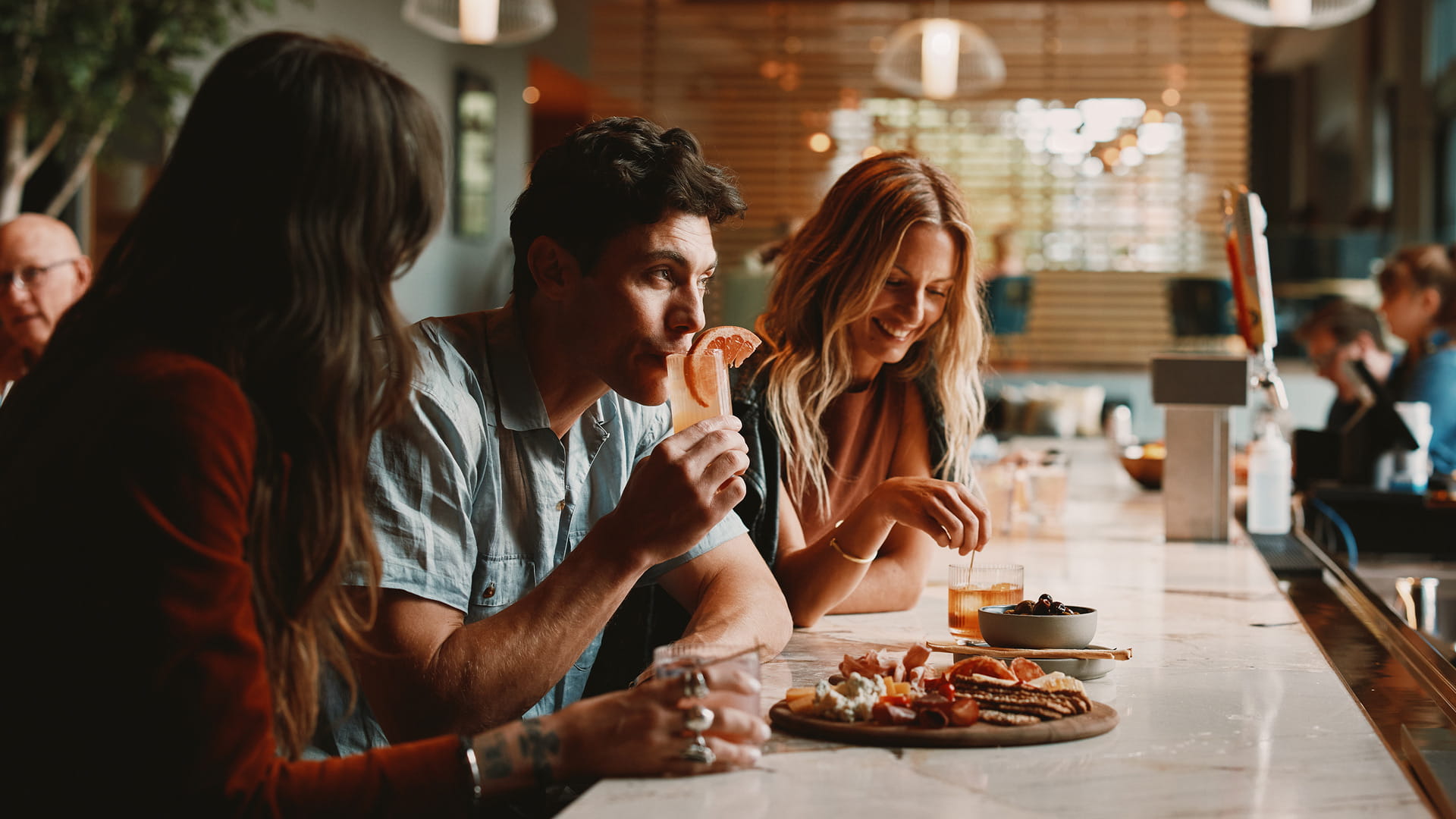 friends having drinks at limelight boulder bar