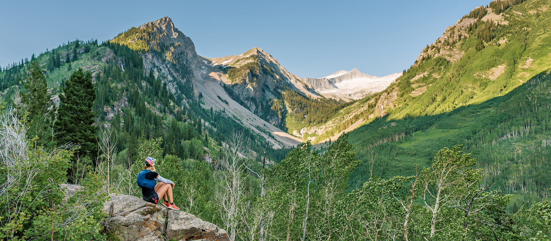 woman looking out at mountain on hike