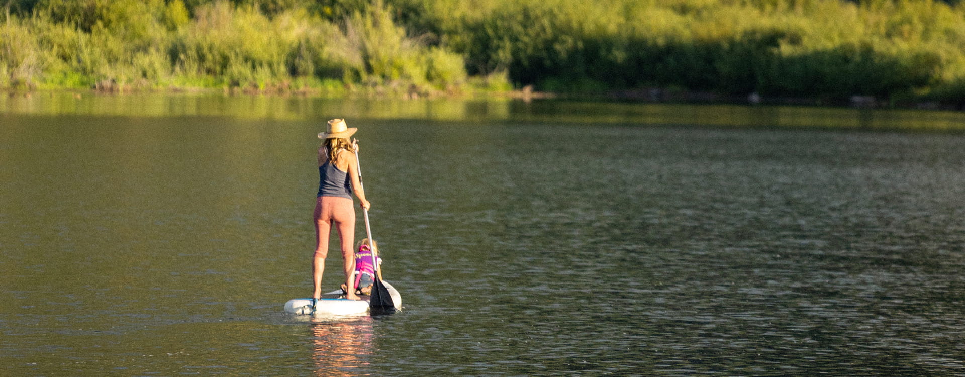 woman on sup on lake