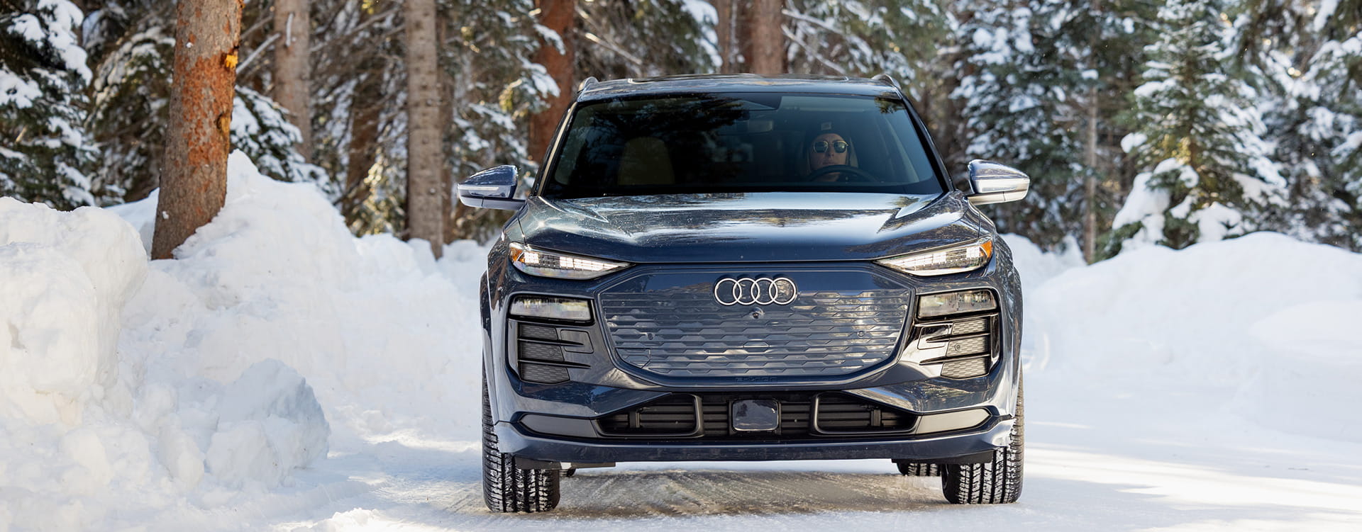 audi car driving in forest in winter
