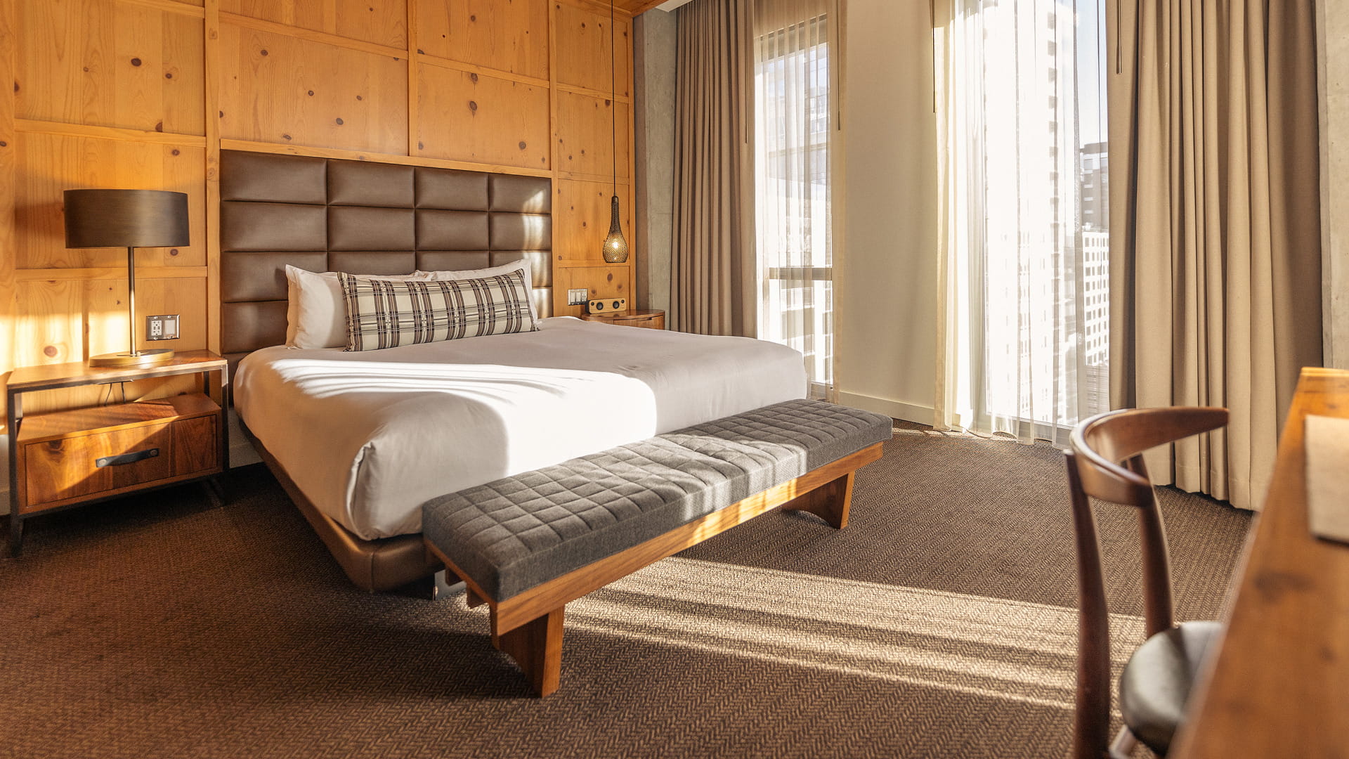 bed in guest room at limelight denver