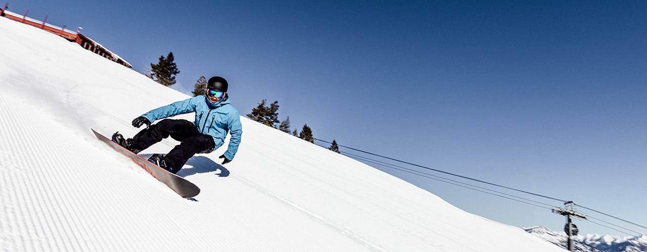 snowboarder skiing empty run