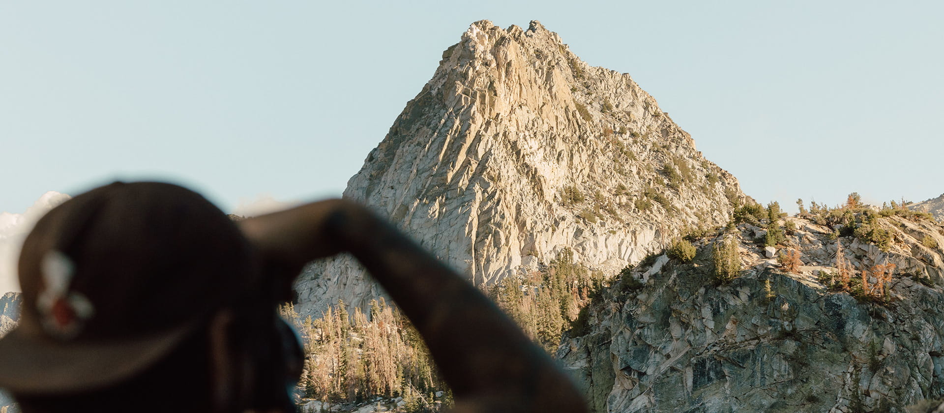 person taking picture of sierras in the summer