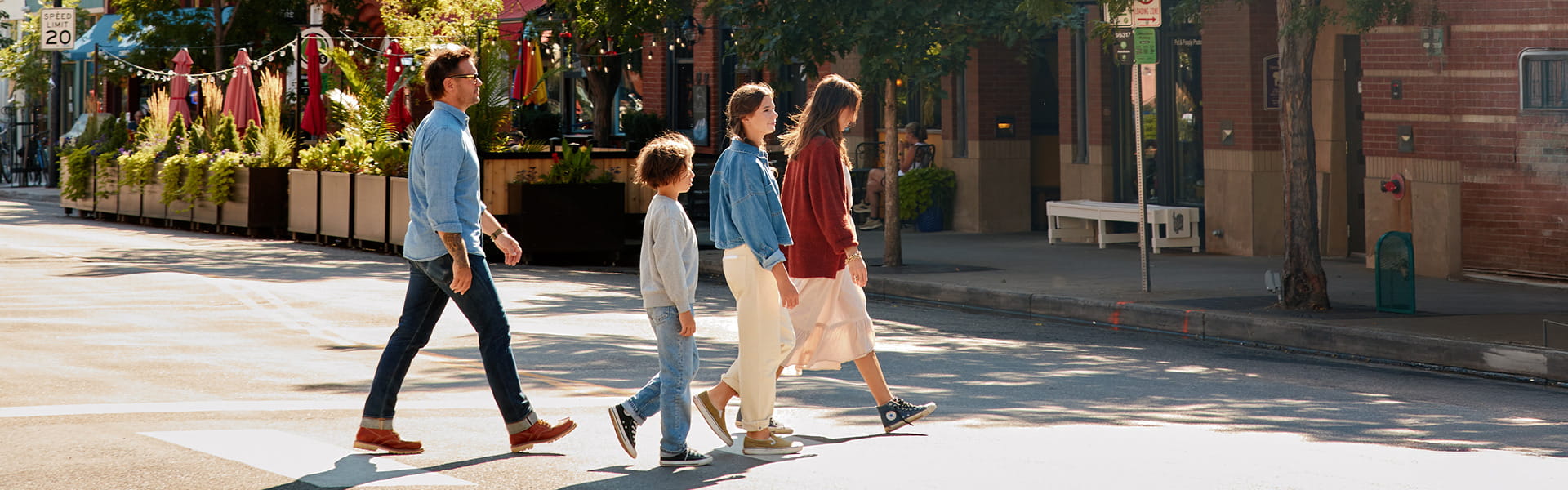 family walking on pearl st in boulder