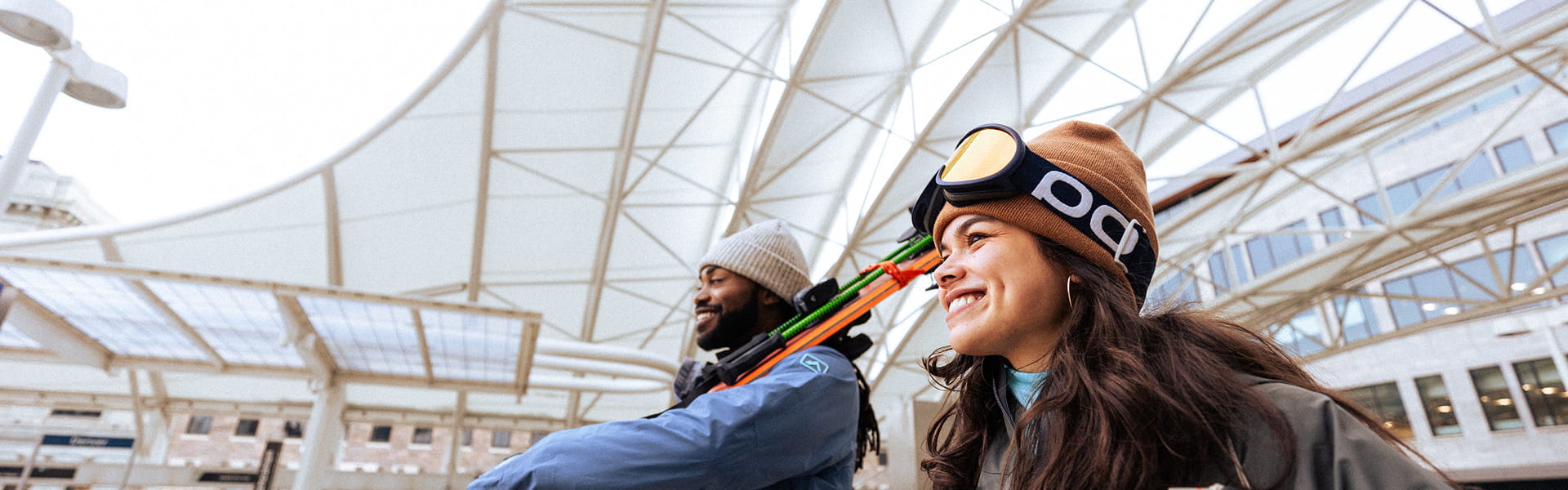 two skiers walking in union station