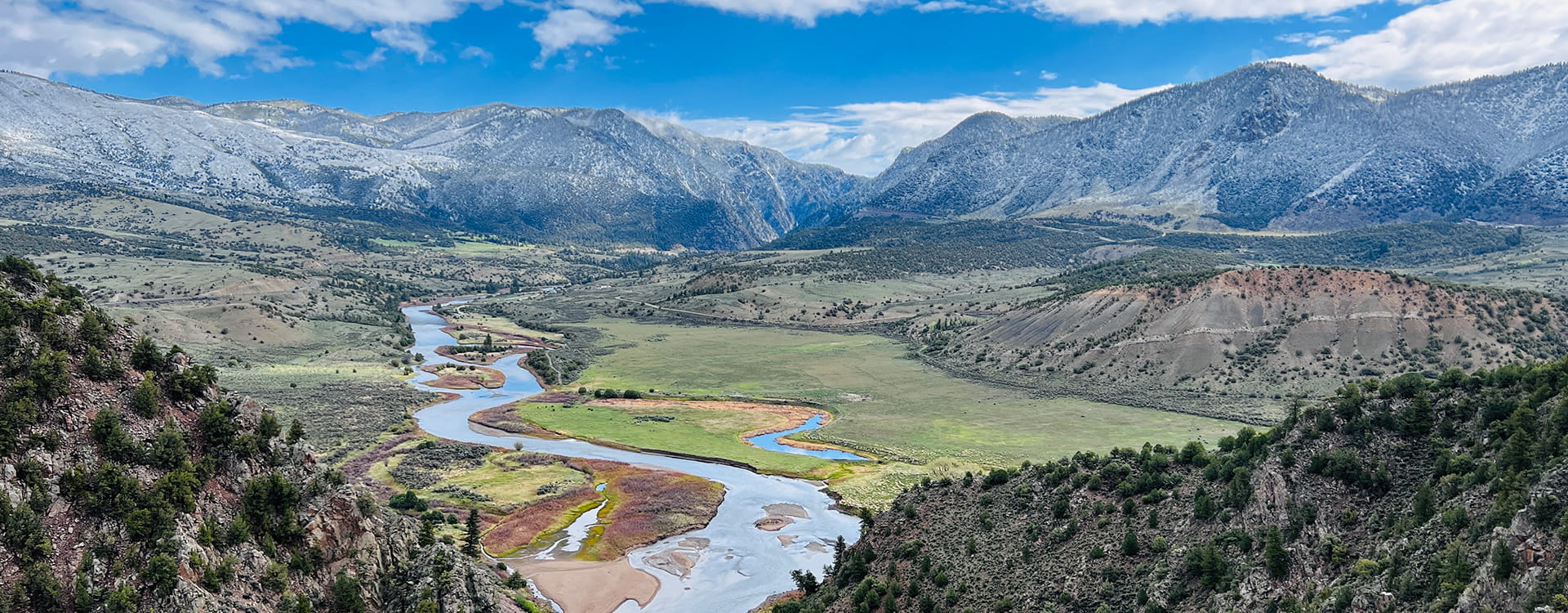Aerial view of Colorado River during summer with mountains